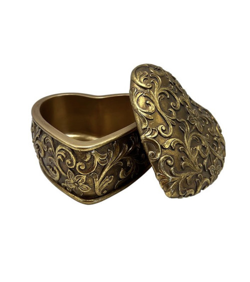 boîte à bijoux dorée style vintage ouverte avec détails arabesques