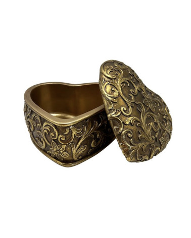boîte à bijoux dorée style vintage ouverte avec détails arabesques