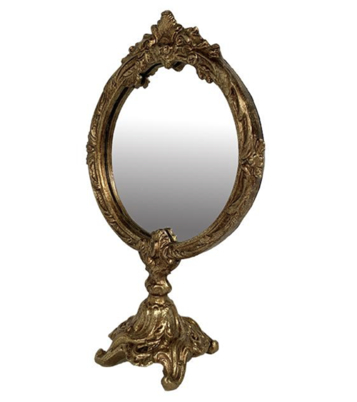 Détail du miroir sur pied doré baroque avec base sculptée, objet déco doré chic et raffiné.