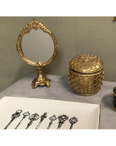 Miroir sur pied doré