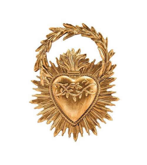 Détail du cœur sacré doré orné de motifs végétaux