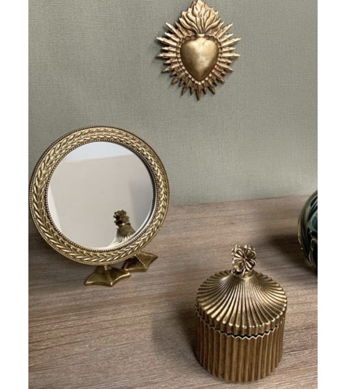 Miroir à poser doré avec pieds en forme de pattes de canard, décoration originale et élégante.