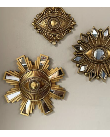 Miroir œil doré 17 cm dans une composition murale de miroirs