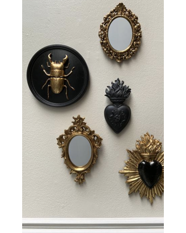 Petit miroir ovale doré à ornements